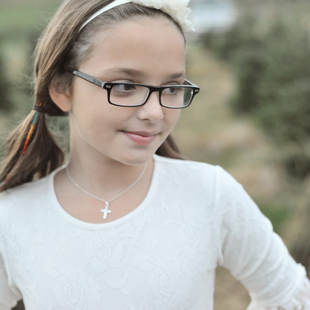 Pink cross necklace.